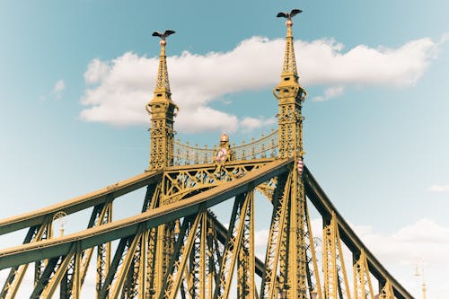 A large golden bridge with two towers