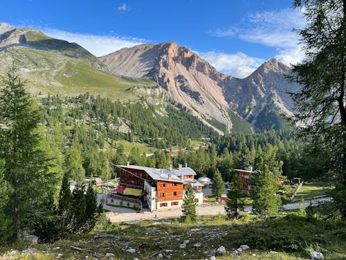 A mountain village with a mountain in the background