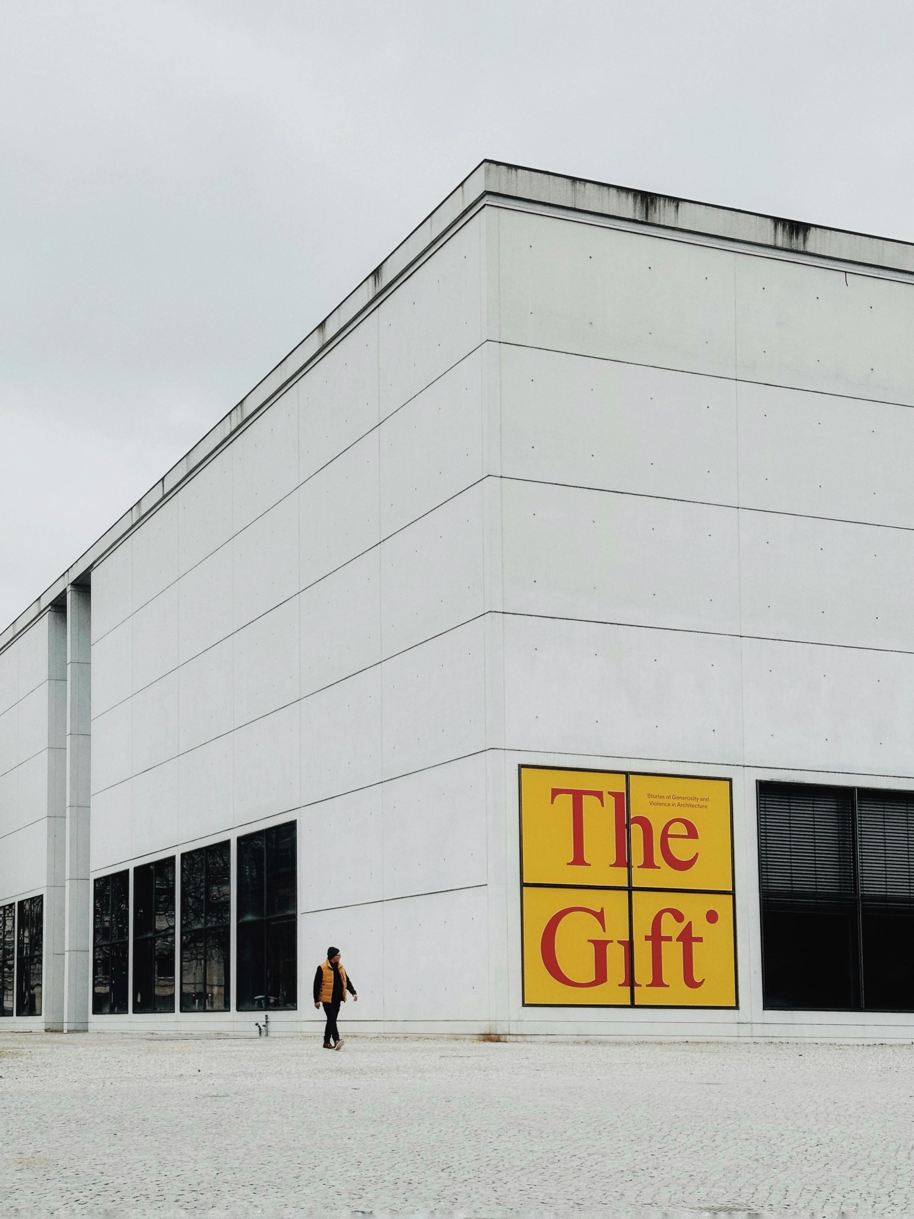 Modern art museum exterior with a passerby in Munich, Germany.