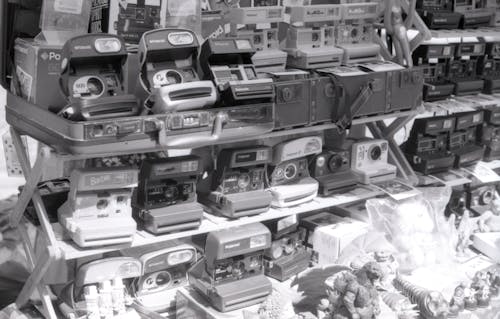 A black and white photo of a store with many toys