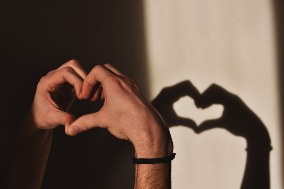 Free Person Doing Heart Hand Gesture Stock Photo