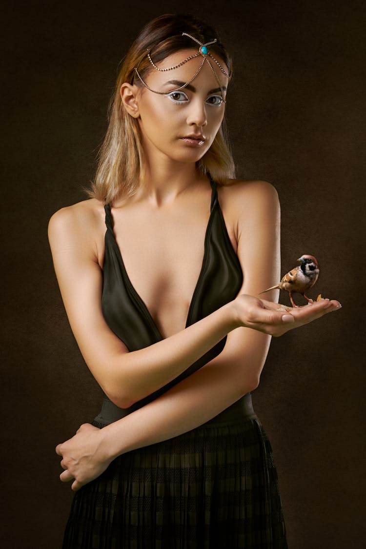 Photo Of Woman Holding Brown Bird