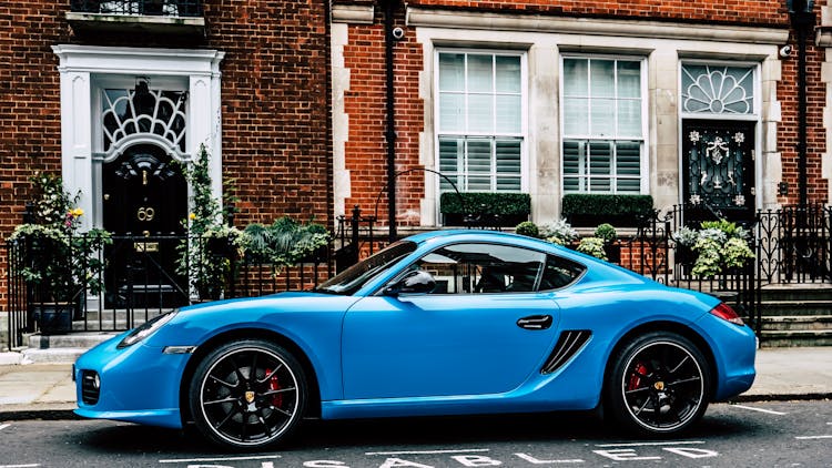 Blue Coupe On Road