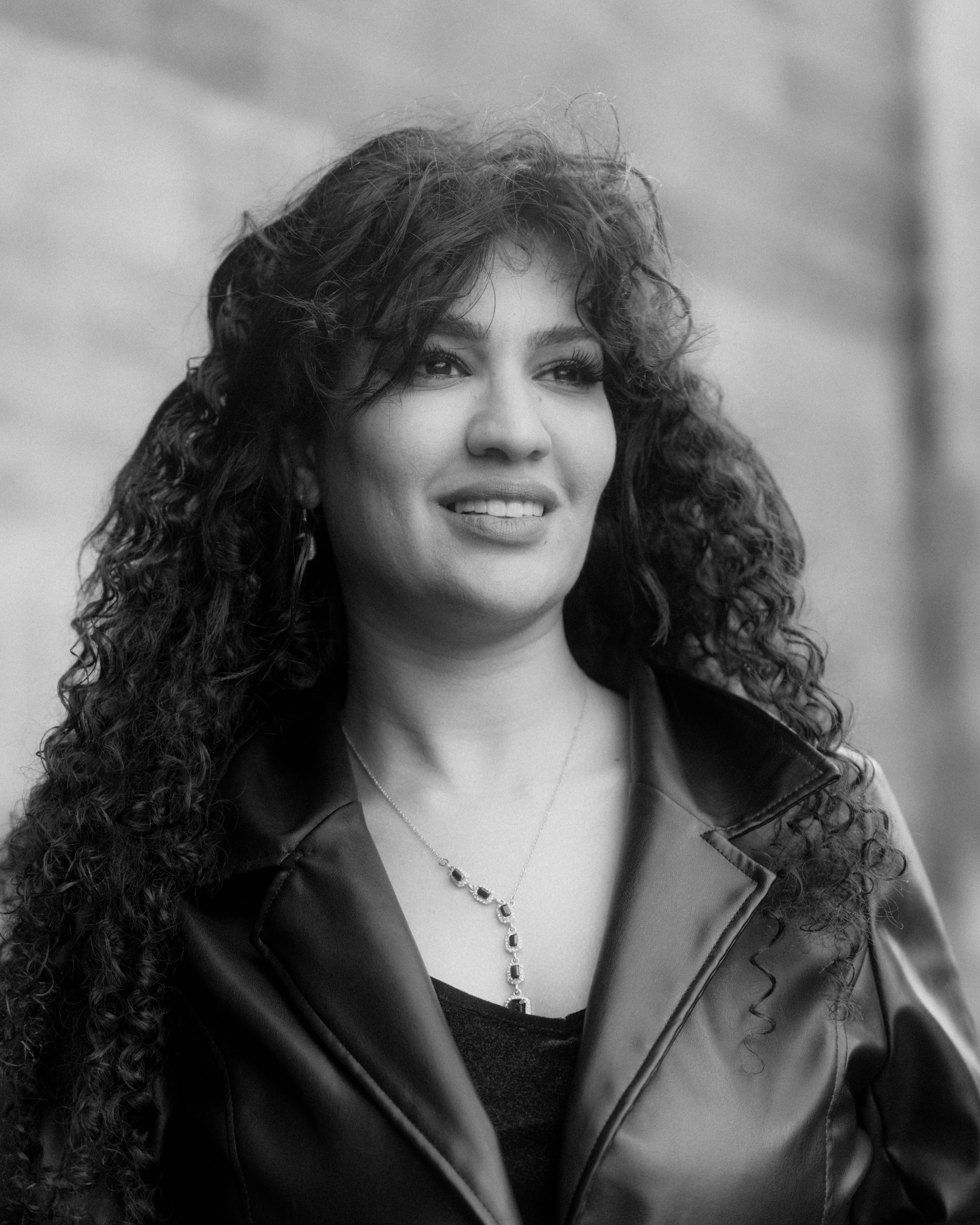 Portrait of Woman with Curly Hair · Free Stock Photo