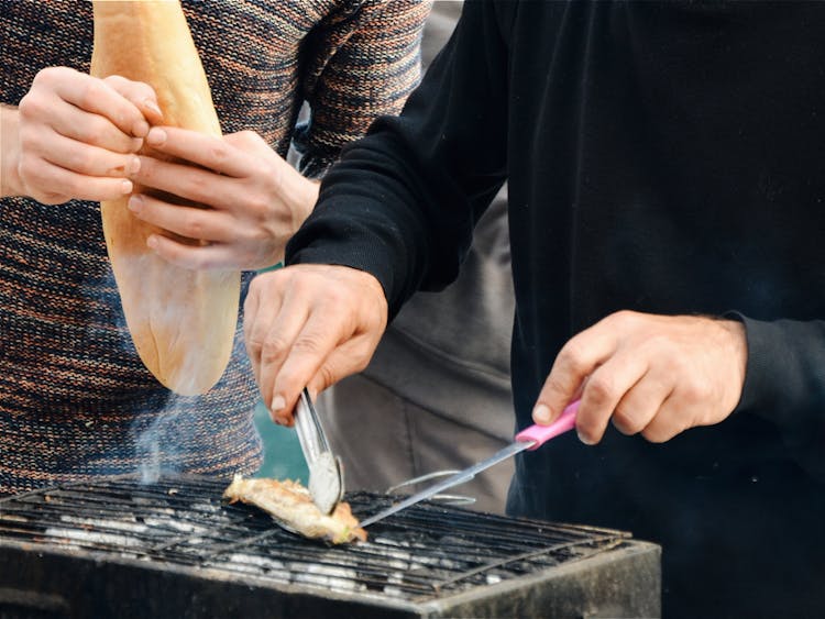 Person Grilling Outdoors