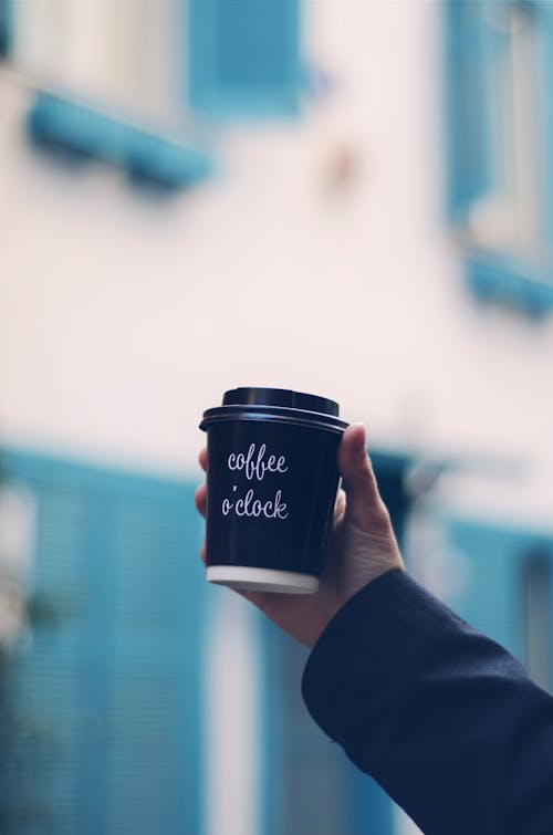 Free Person Holding Cup of Coffee Stock Photo