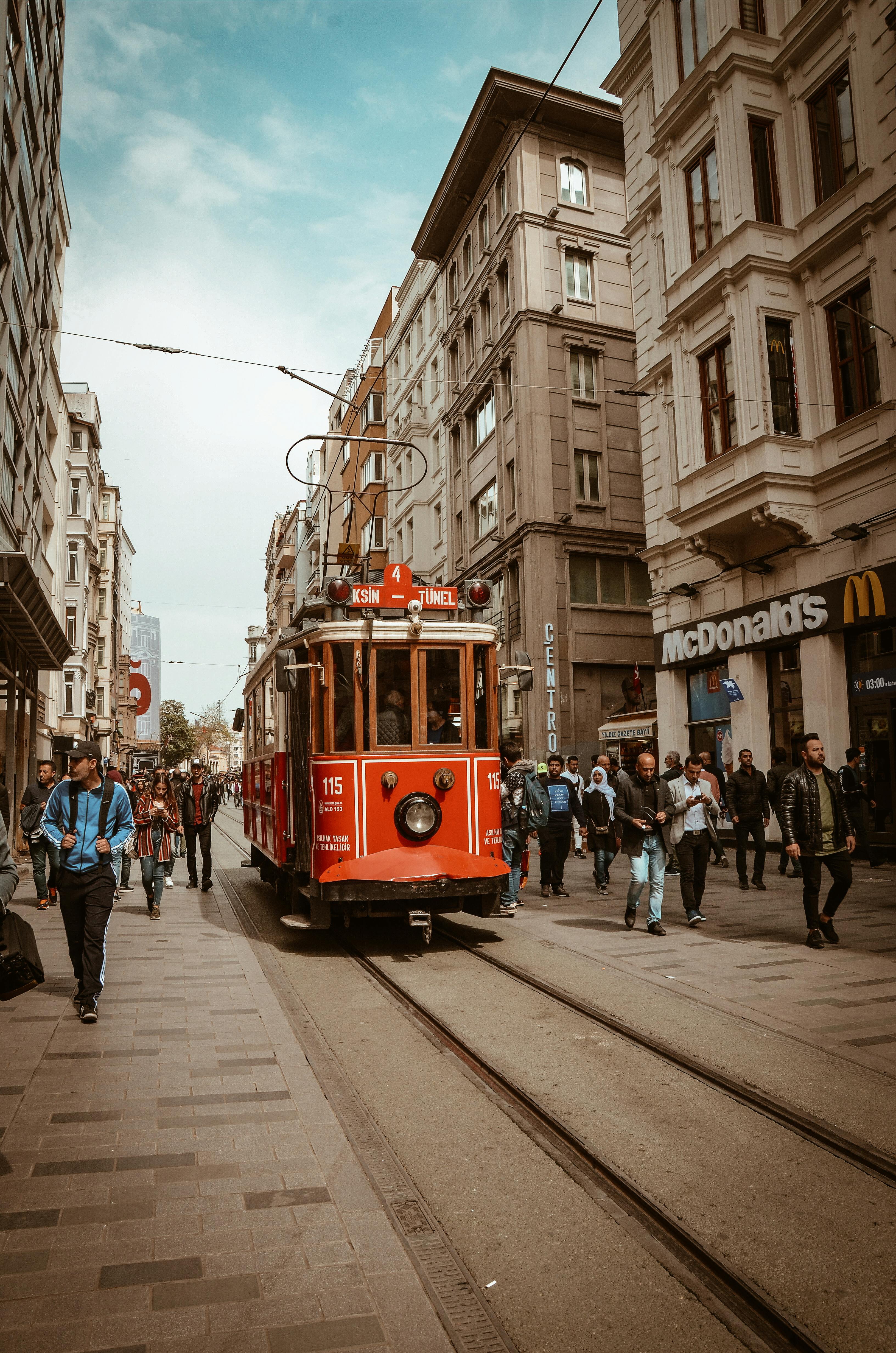 red train between people