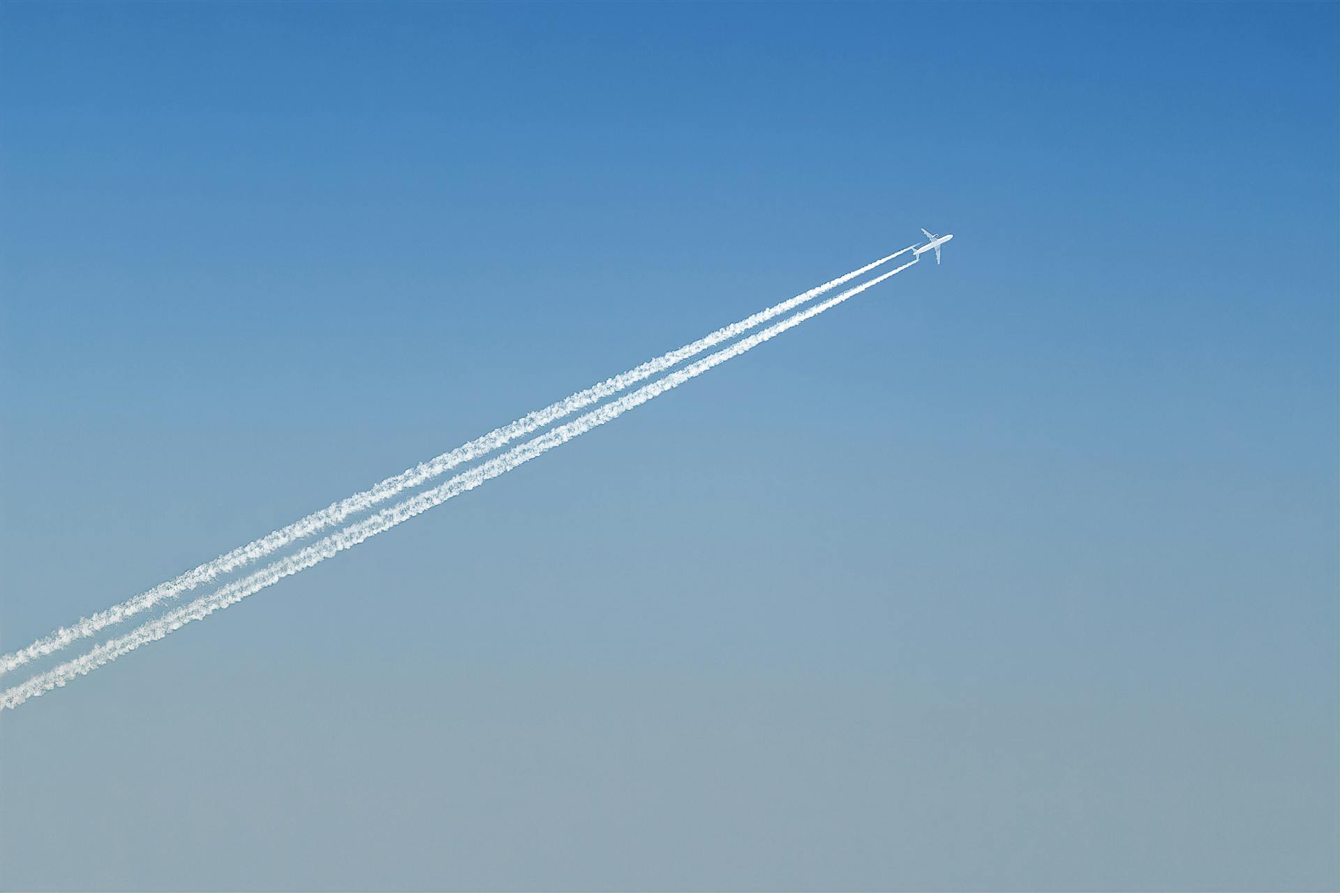 Plane Leaving Cloud Contrails