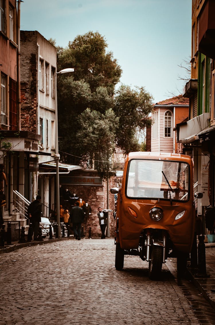 Parked Auto Rickshaw Near Building