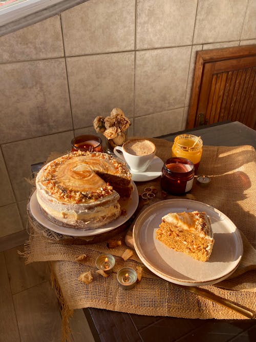 Free A cake with a plate of coffee and a cup of tea Stock Photo