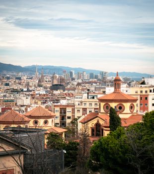 Discover the vibrant Barcelona skyline with historic architecture and modern skyscrapers.