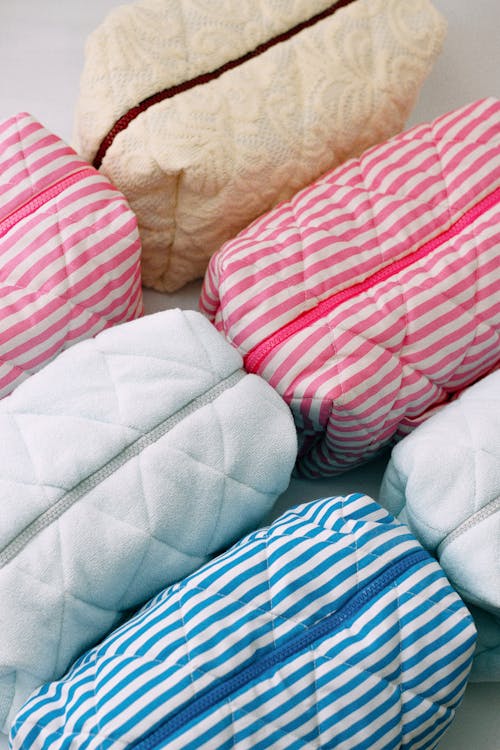 Free A group of four different colored quilted bags Stock Photo