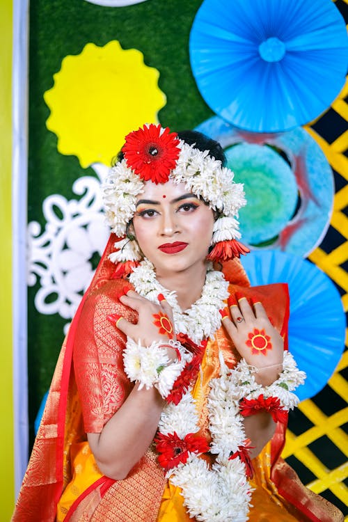 A woman in traditional indian attire posing for a photo