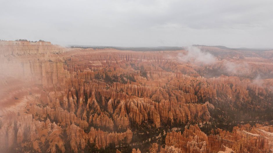 Outstanding Canyonlands National Park Airplane Tour Review: Soaring Above Utah's Most Spectacular Wilderness Review 2026 - Stunning aerial shot of Bryce Canyon's iconic hoodoos under a cloudy sky, perfect for travel inspiration.