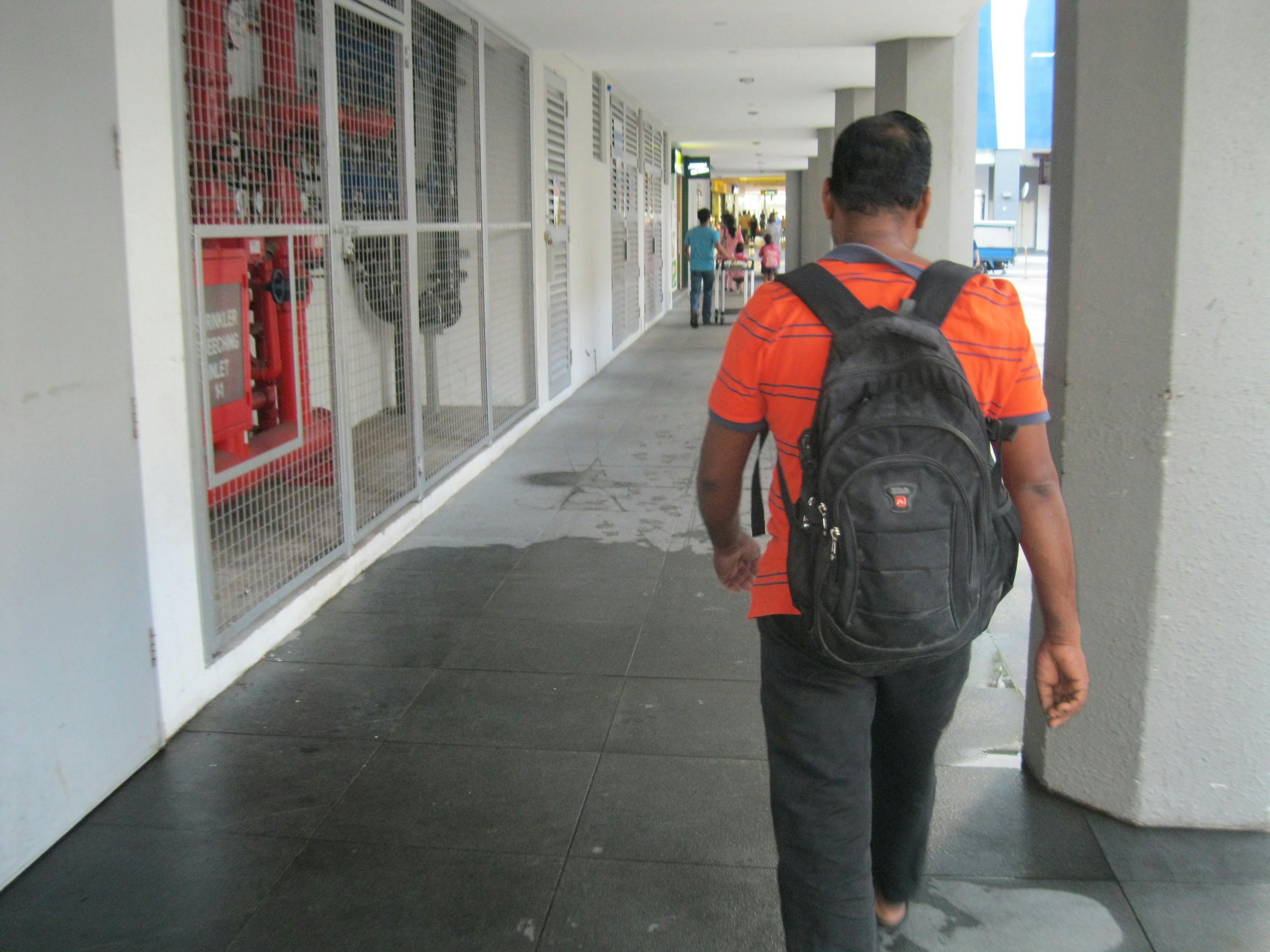 Image result for man carryingblack backpack