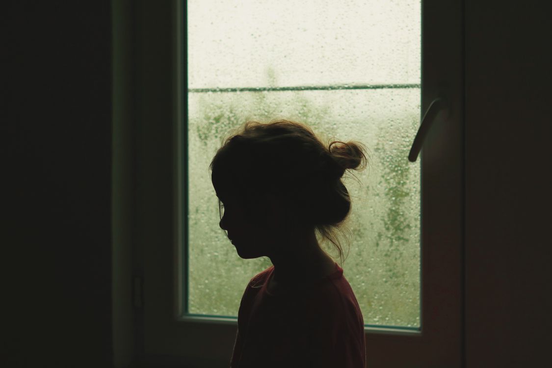 Girl Standing near Window with Raindrops · Free Stock Photo