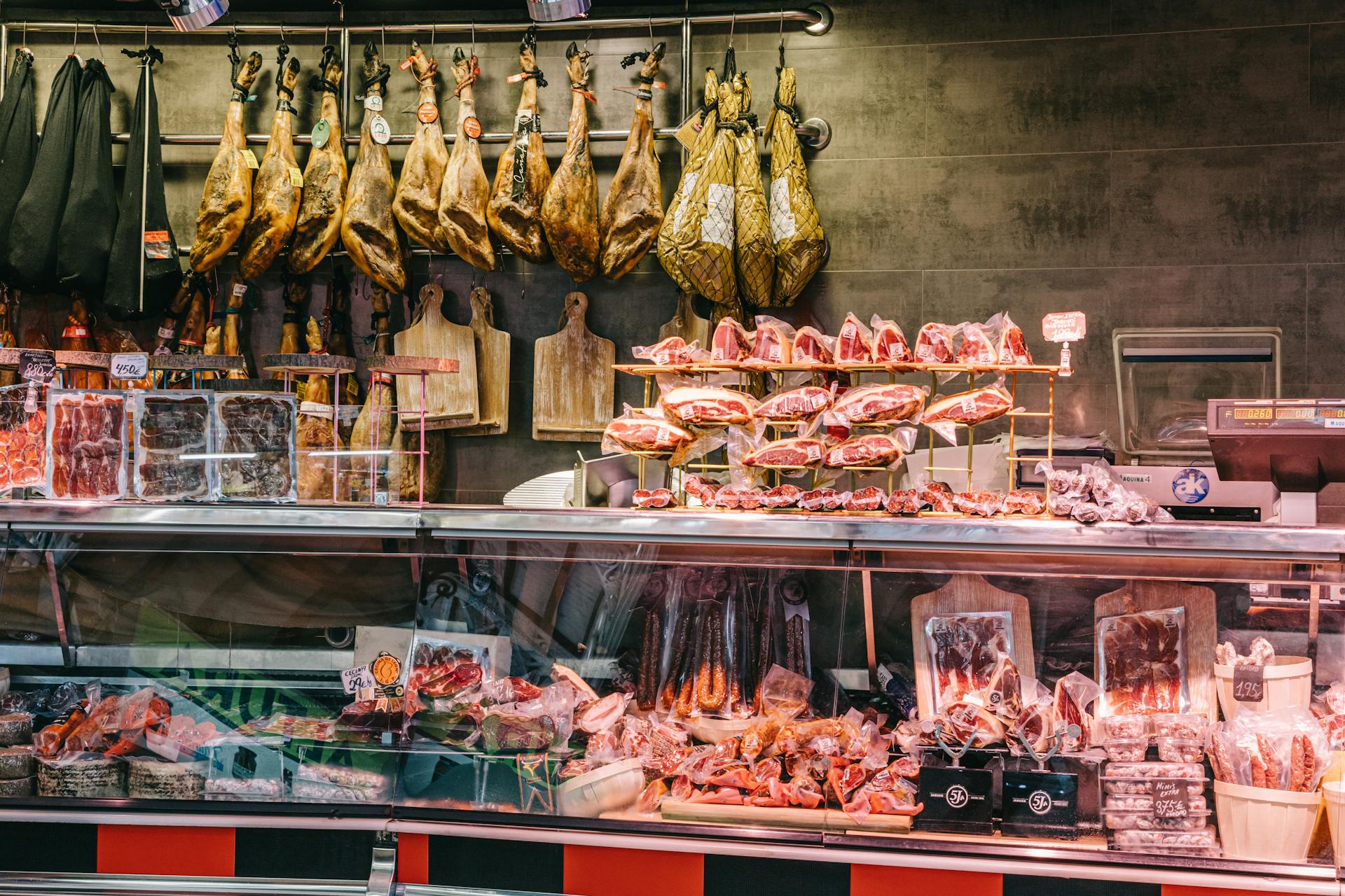 A butcher shop with meat and other items on display