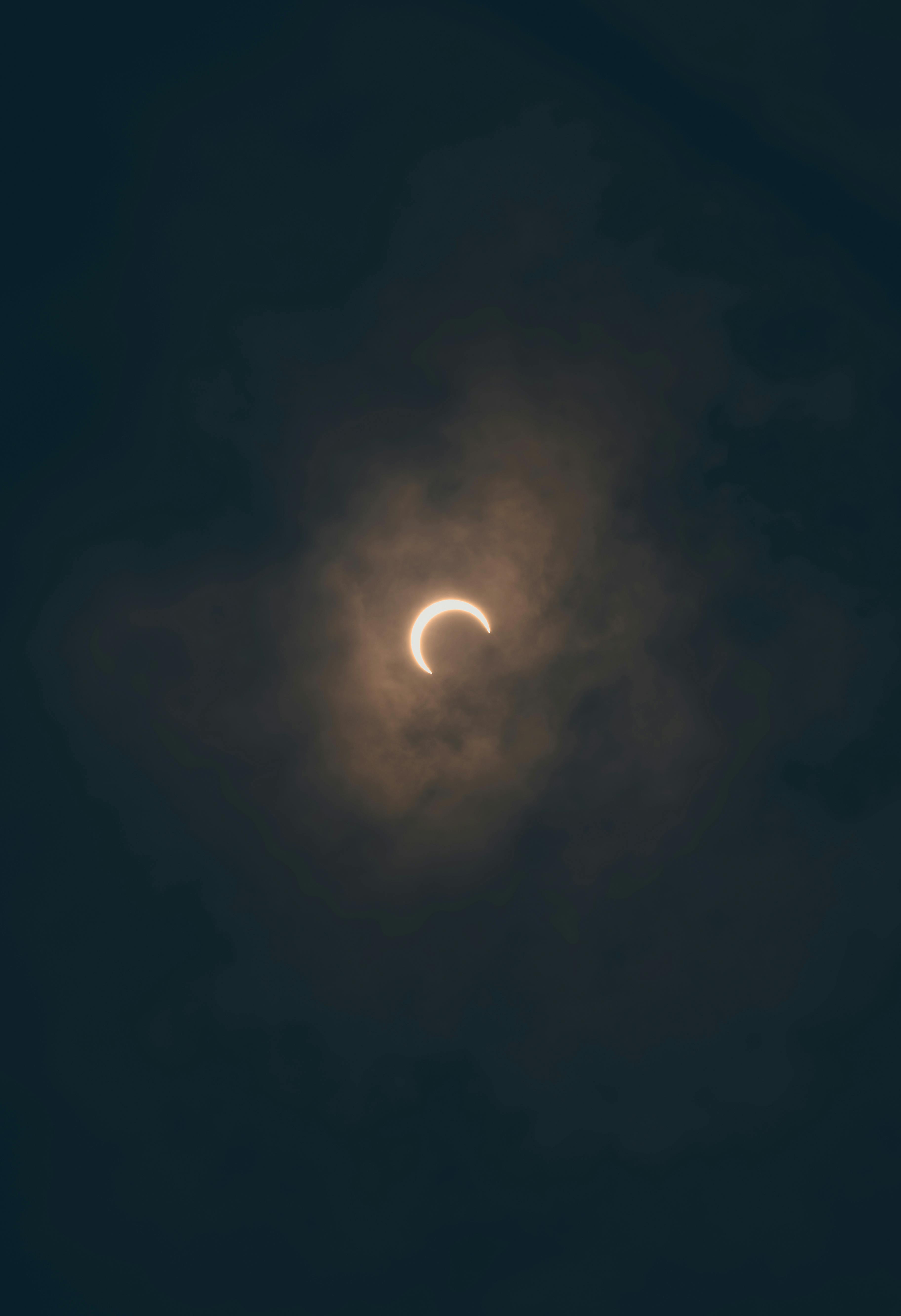 Stunning solar eclipse captured through clouds in Akumal, Quintana Roo, Mexico.