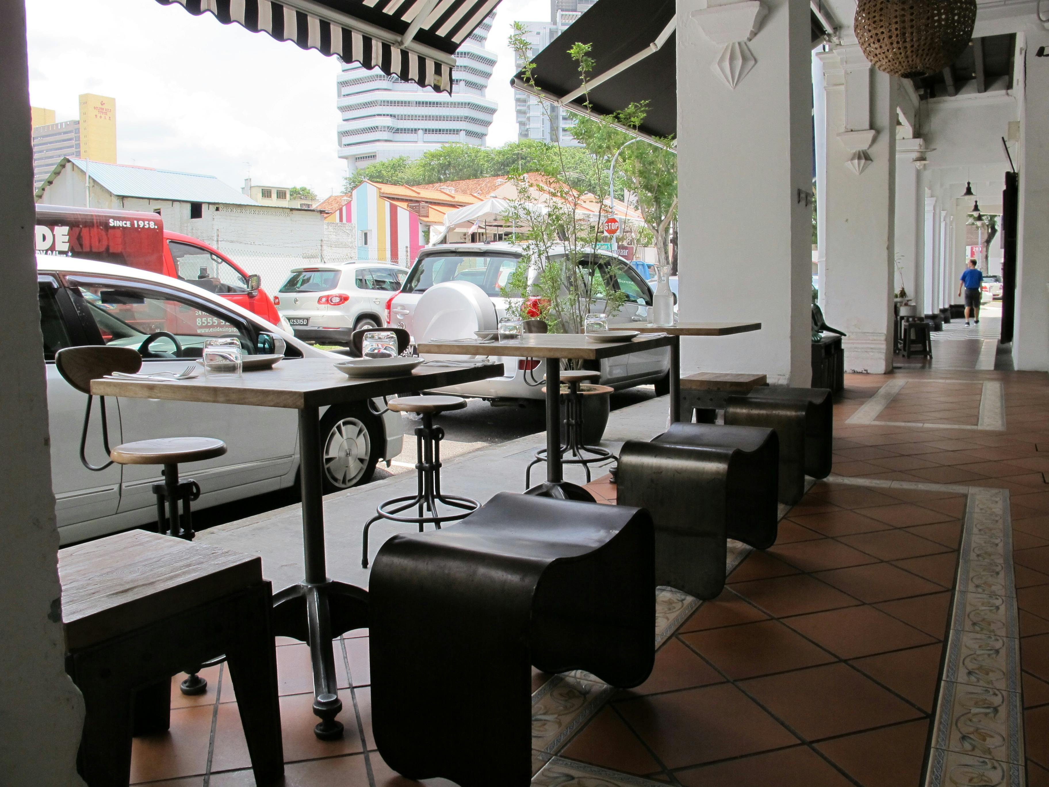 Free stock photo of Tables and chairs outside cafe