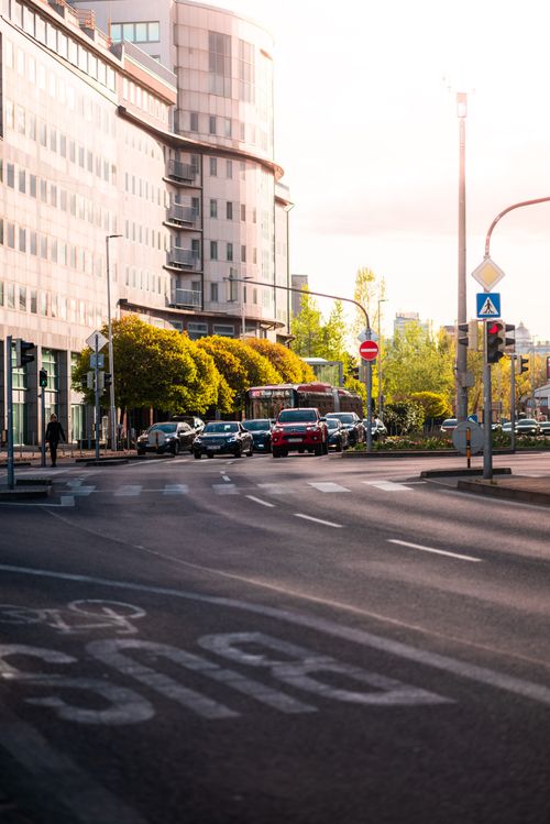 Free Urban scene in Bratislava, Slovakia featuring traffic, modern architecture, and lush trees in daylight. Stock Photo