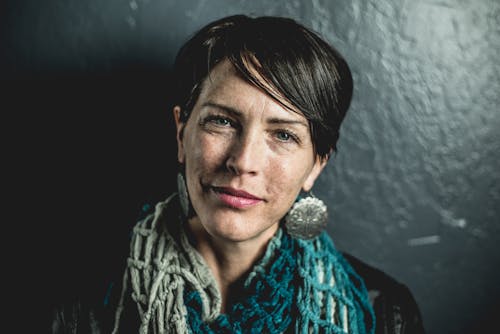 Woman Leaning on Wall