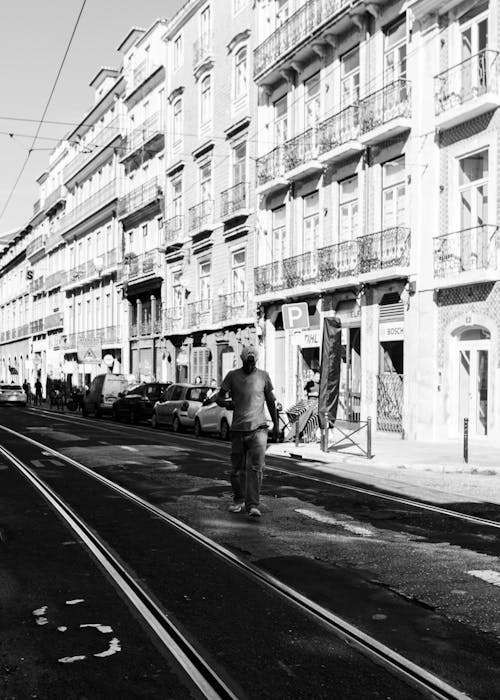 A man walking down the street on a city street