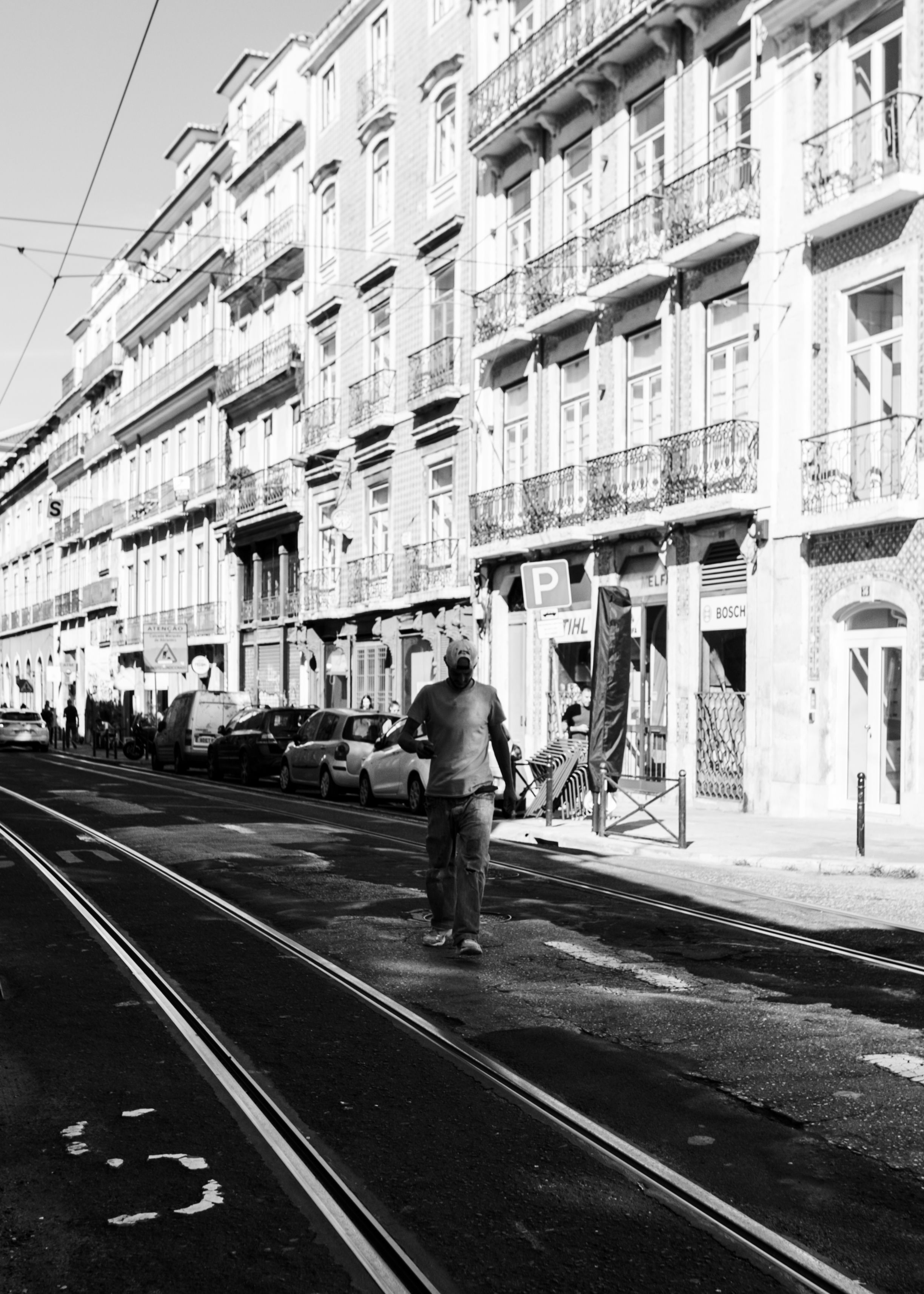 Man Walking on Street in Black and White · Free Stock Photo