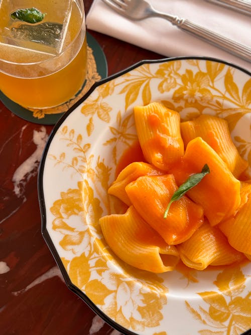 Free Pasta on a Plate Served in a Restaurant  Stock Photo