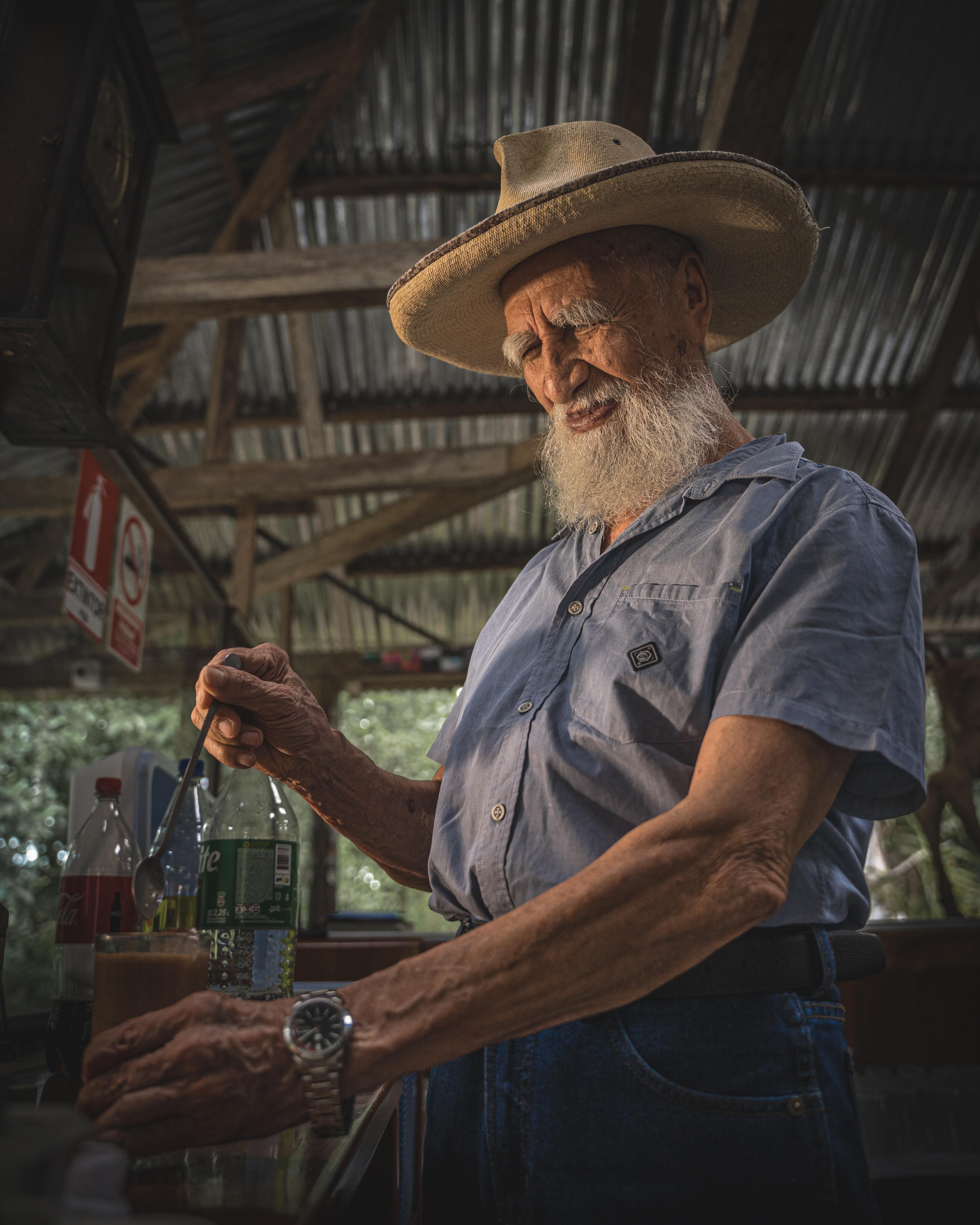 Elderly Man in a Barn · Free Stock Photo