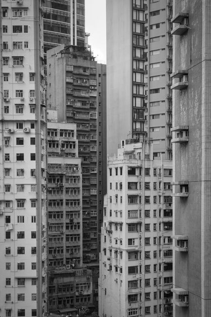 Monochrome view of densely packed residential skyscrapers in a city.