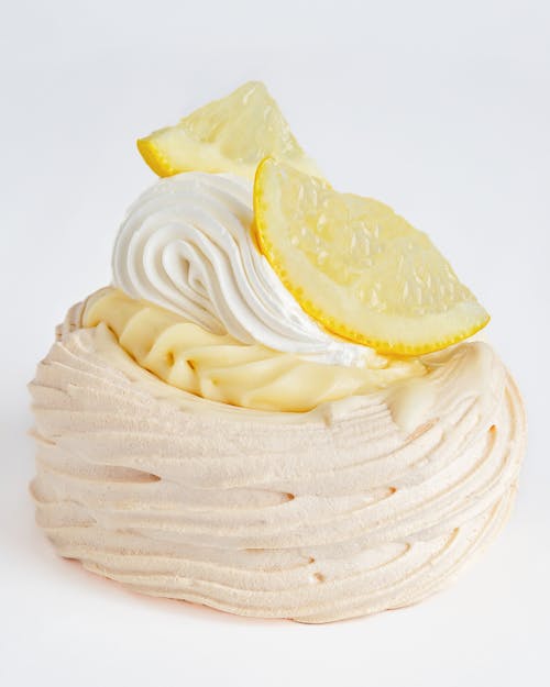 A white pastry with lemon slices on top