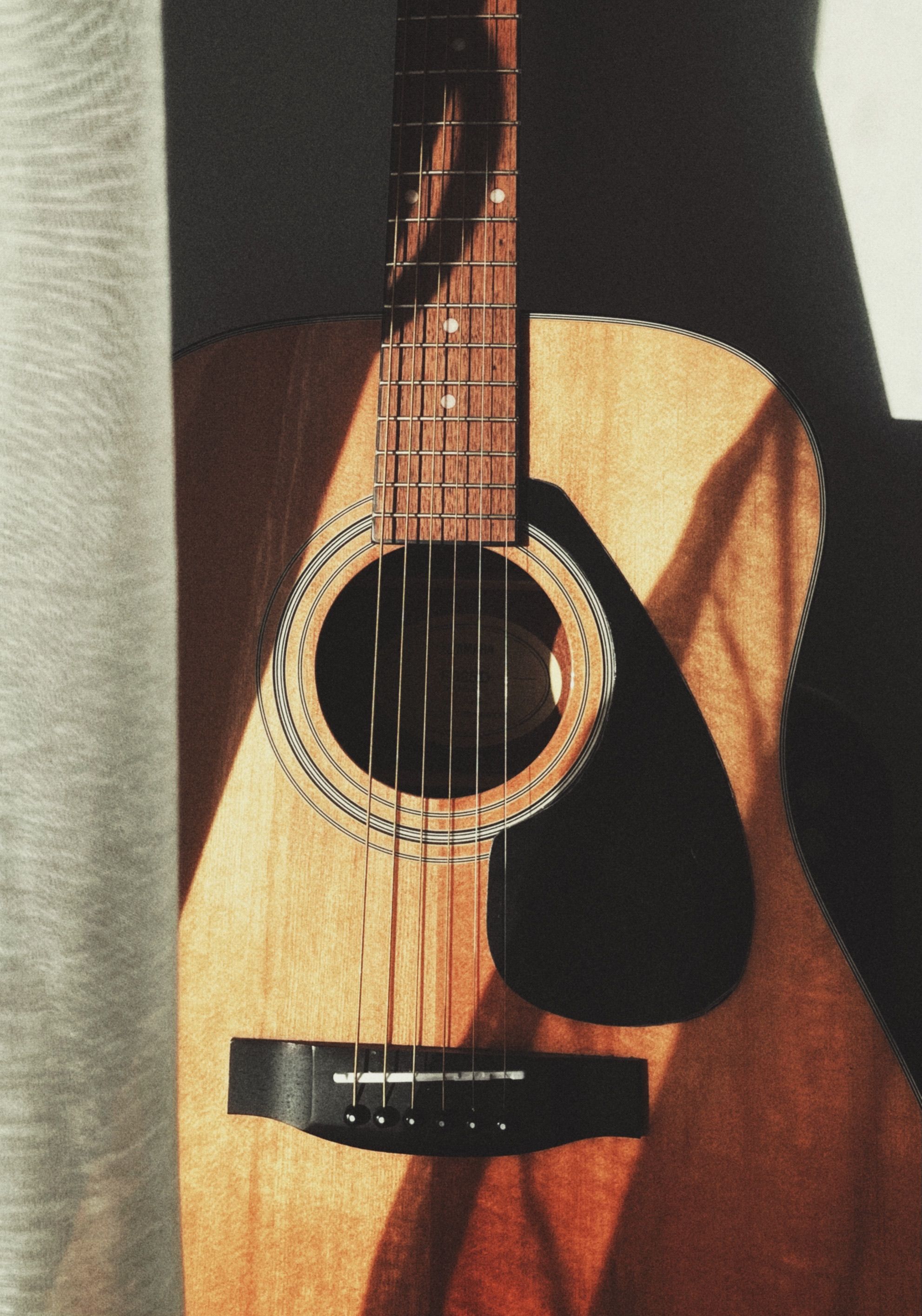 Guitar in Sunlight and Shadow · Free Stock Photo