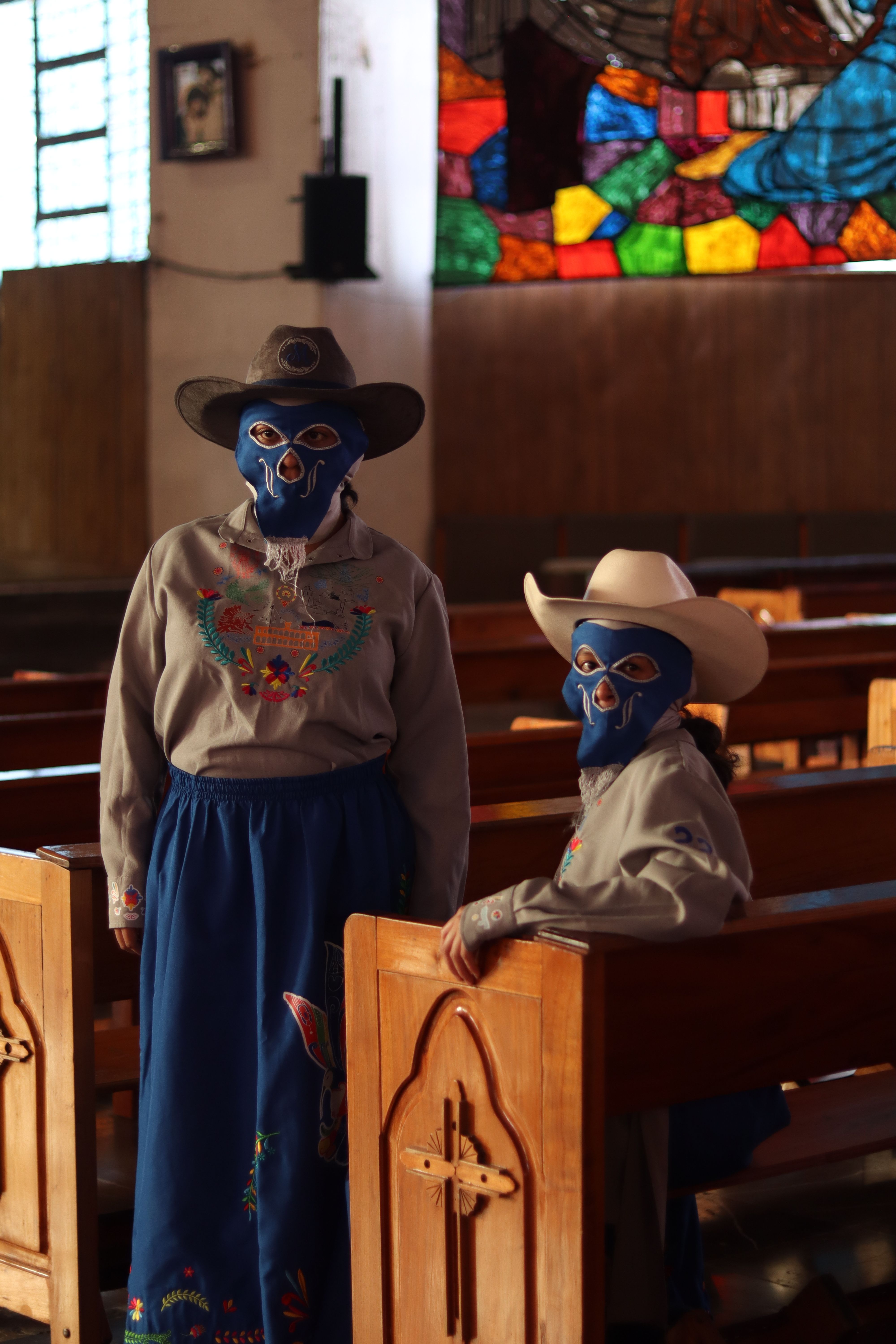 People in Costumes with Masks at Church · Free Stock Photo