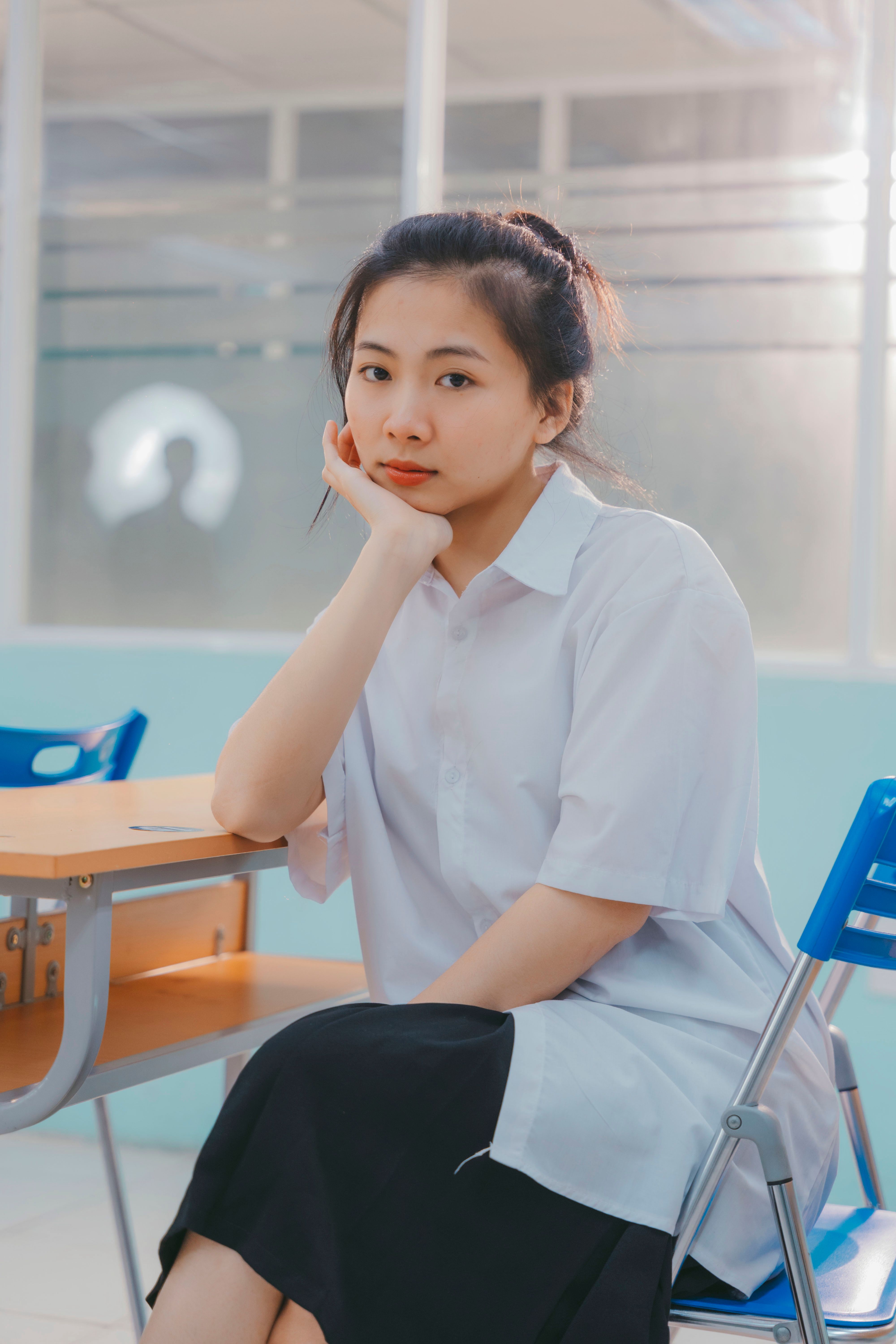 Portrait of a thoughtful instructor in a modern studio