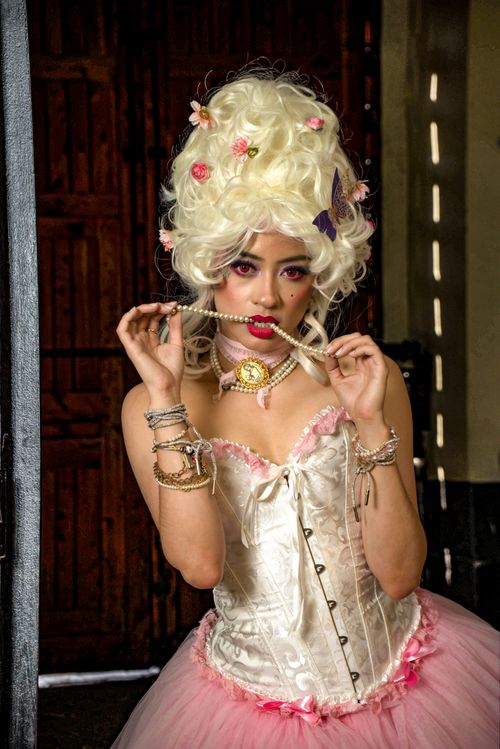 Free Elegant model poses in vintage corset with pearl accessories in Ciudad de México. Stock Photo