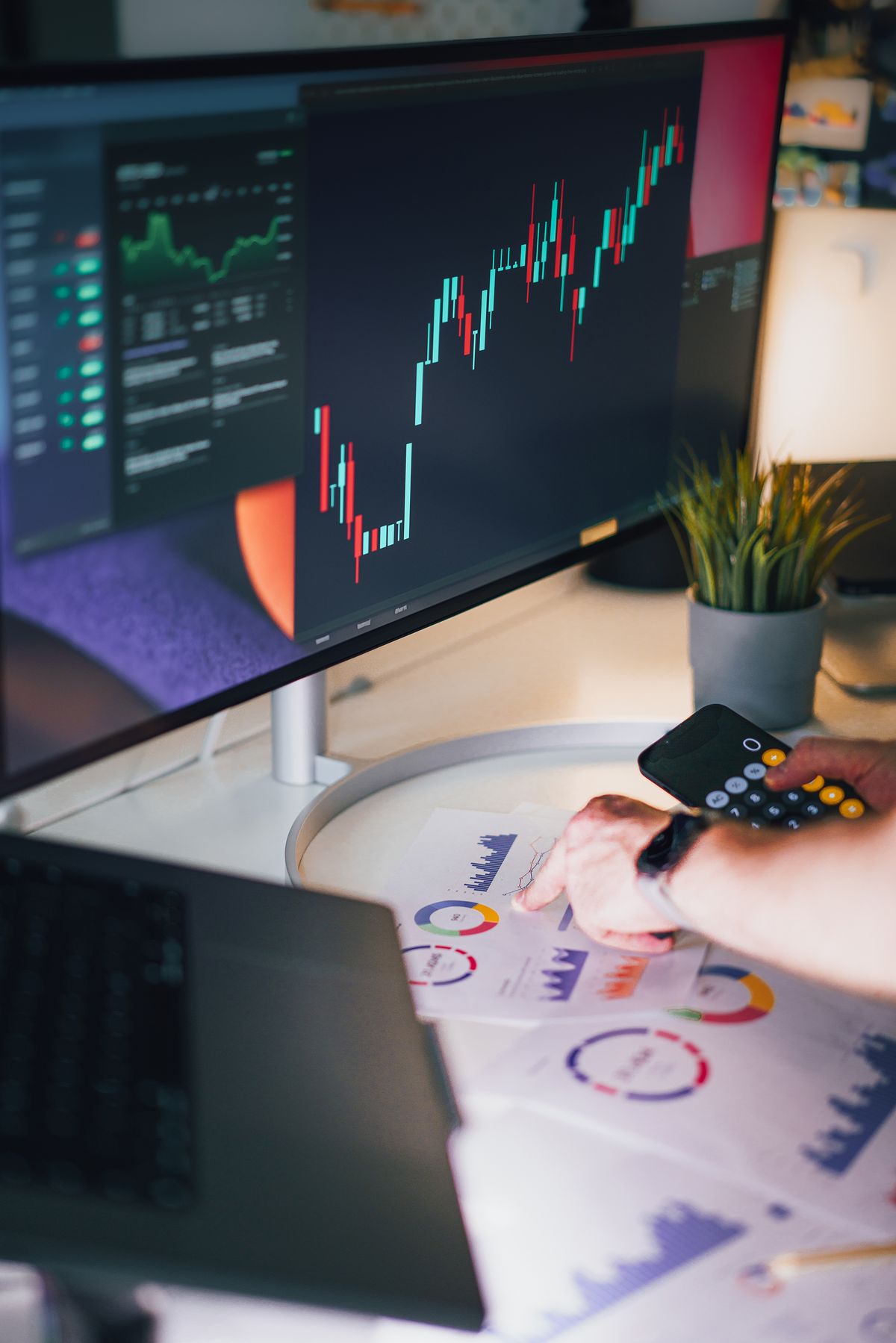 Workspace with financial charts and analysis screens