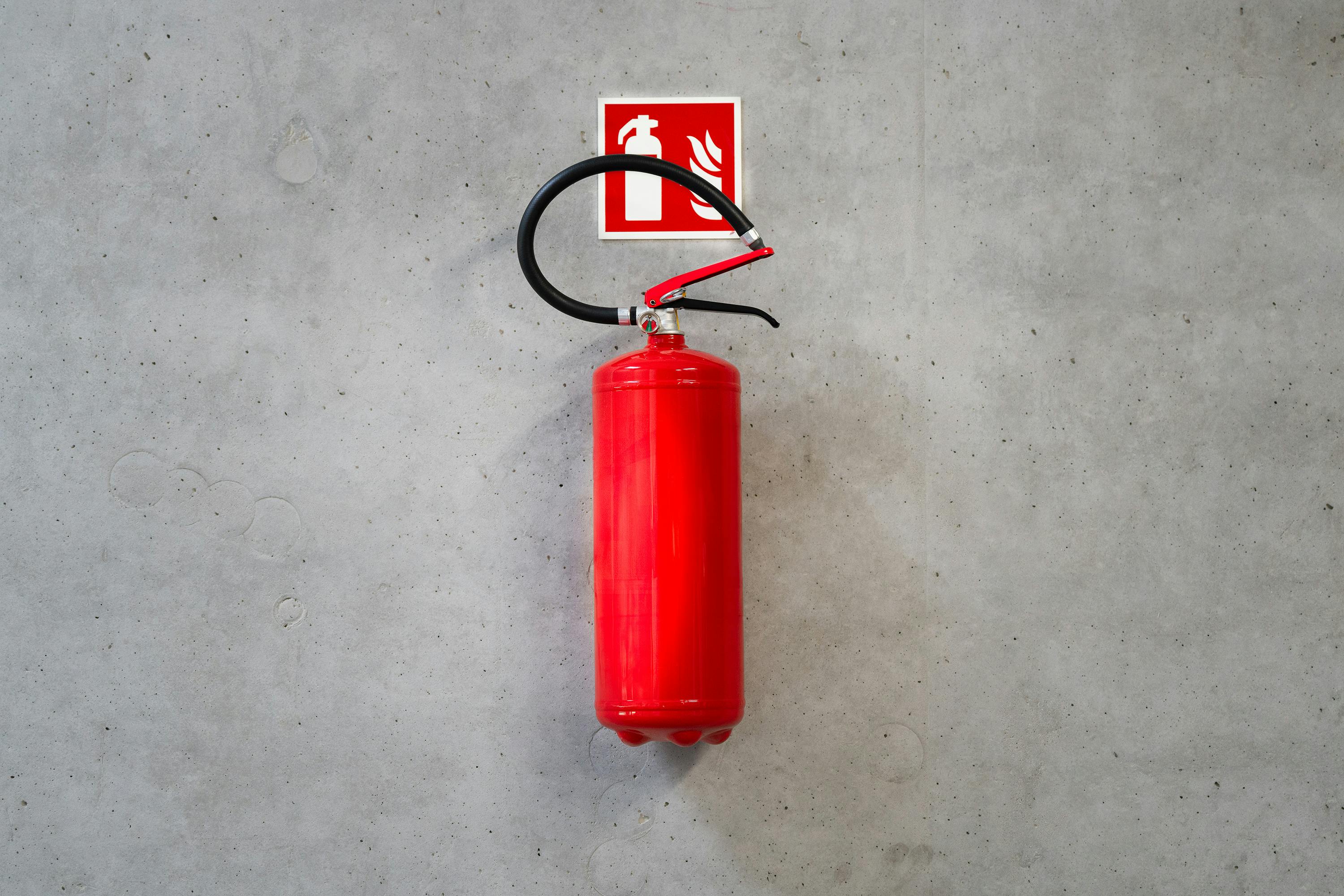 Image Name fire extinguisher placed on a wall
