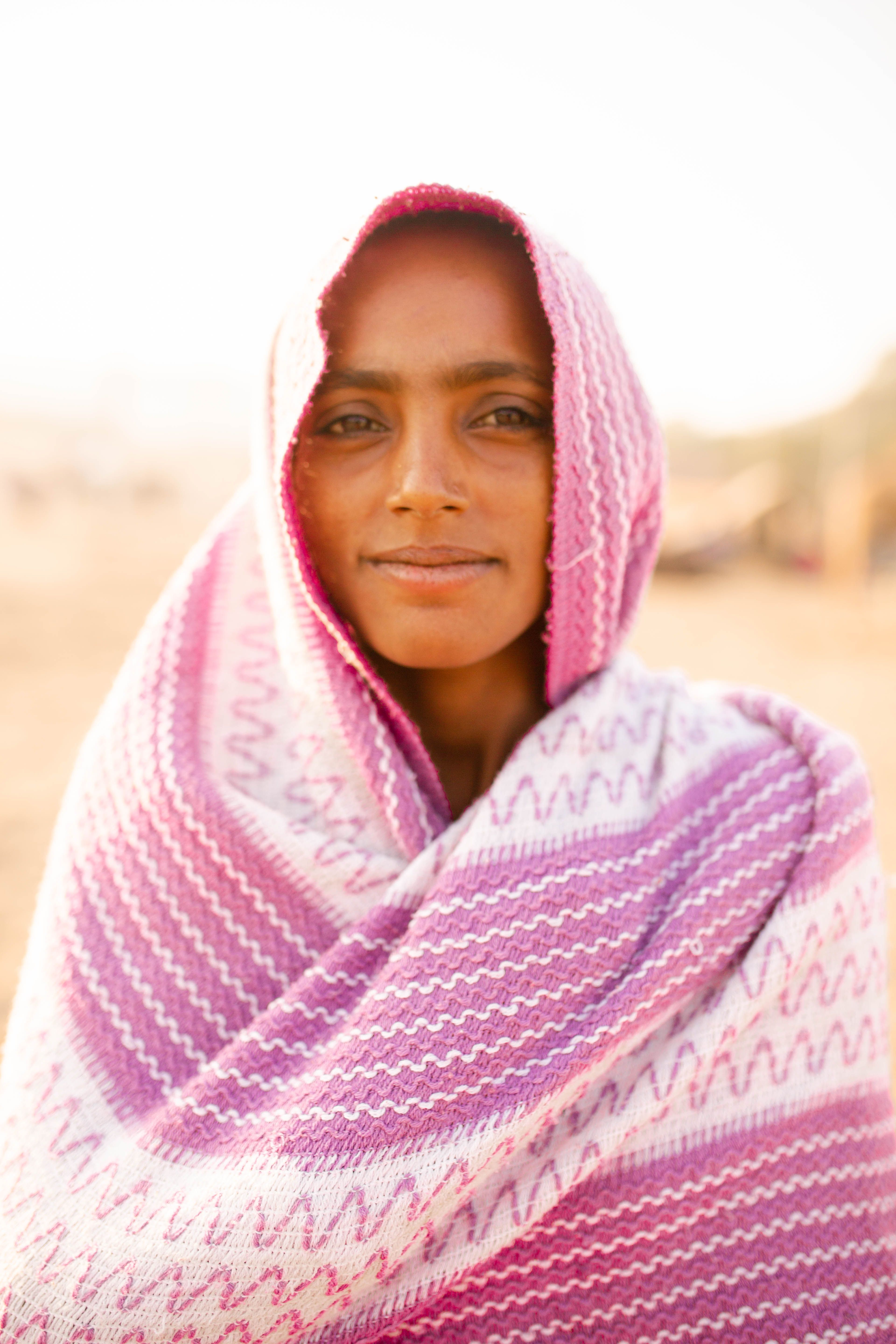 Portrait of a Young Girl Wearing a Pink Headscarf · Free Stock Photo
