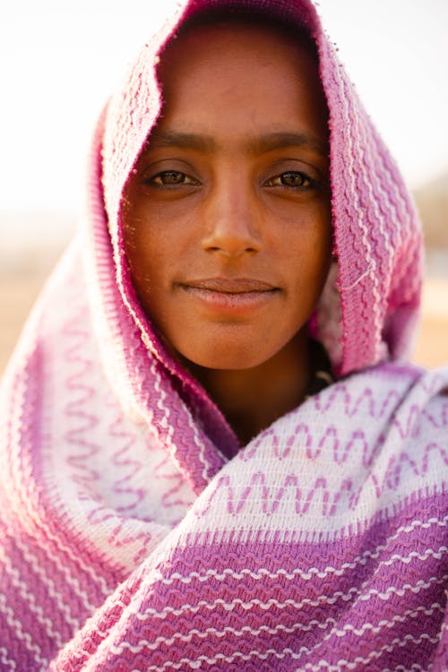 Free Portrait of a Young Girl Wearing a Pink Headscarf  Stock Photo