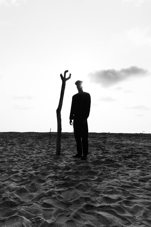 men at beach  in black and white 