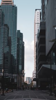 Explore the modern skyline and busy streets of Manila, Philippines featuring tall skyscrapers.