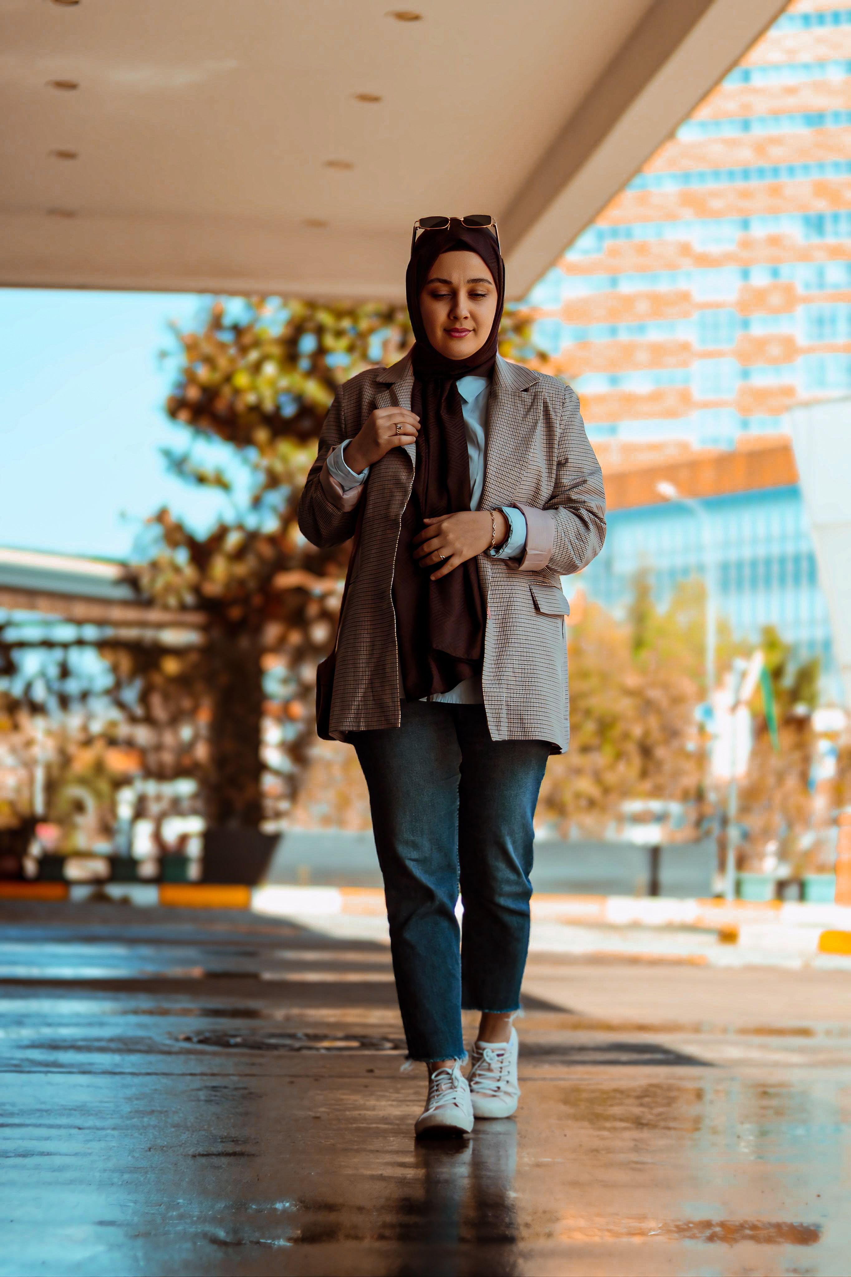 Walking Woman in Jeans and Jacket · Free Stock Photo