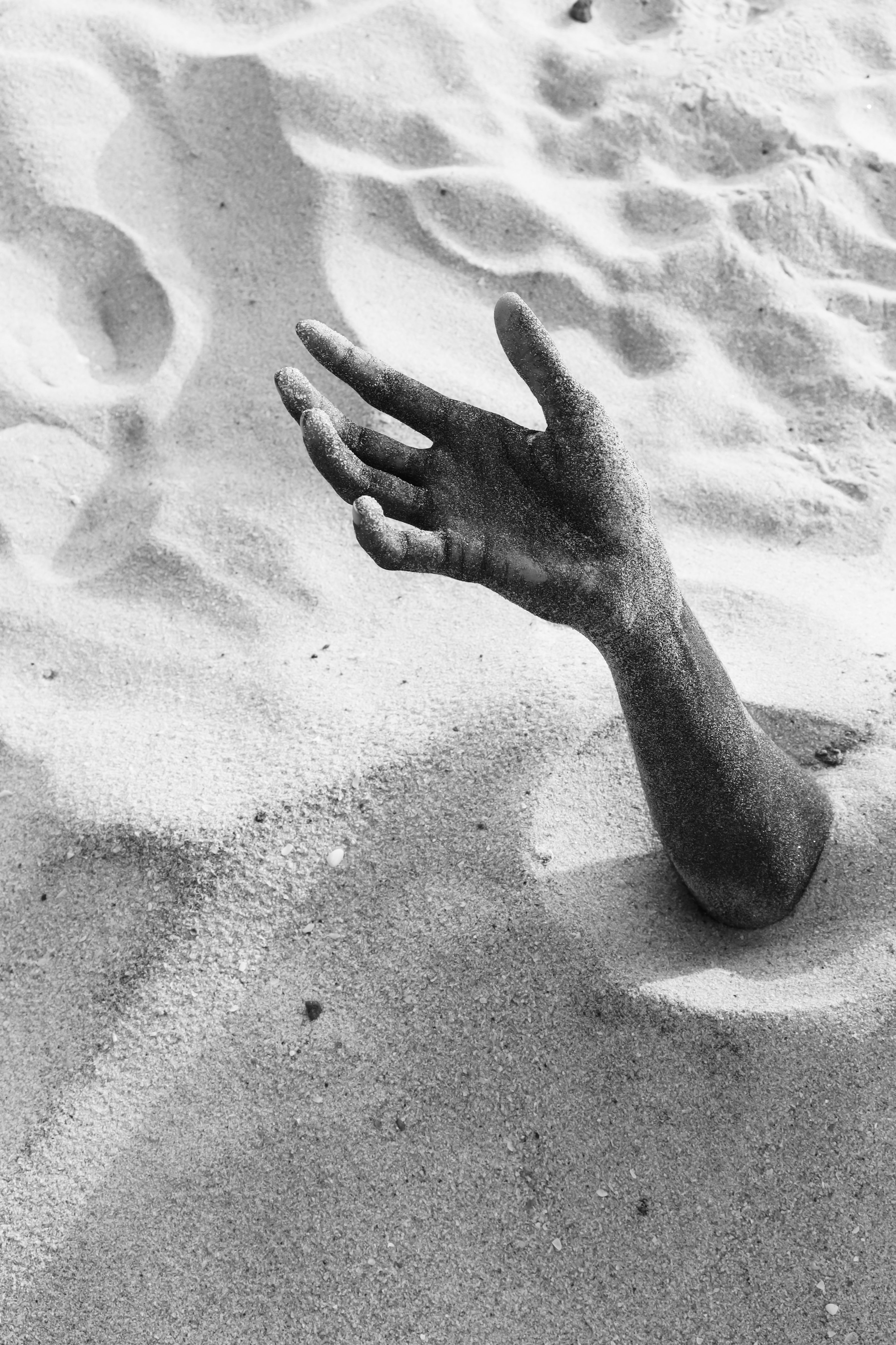 Hand of Man Buried in Sand · Free Stock Photo