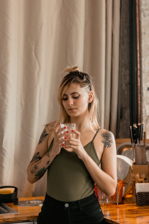 Woman Holding Drinking Glass