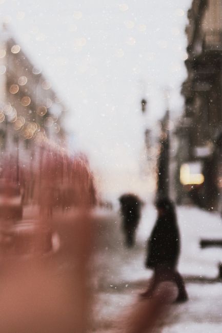 Blurred urban winter scene with snow in Moscow, capturing a serene and atmospheric street view.