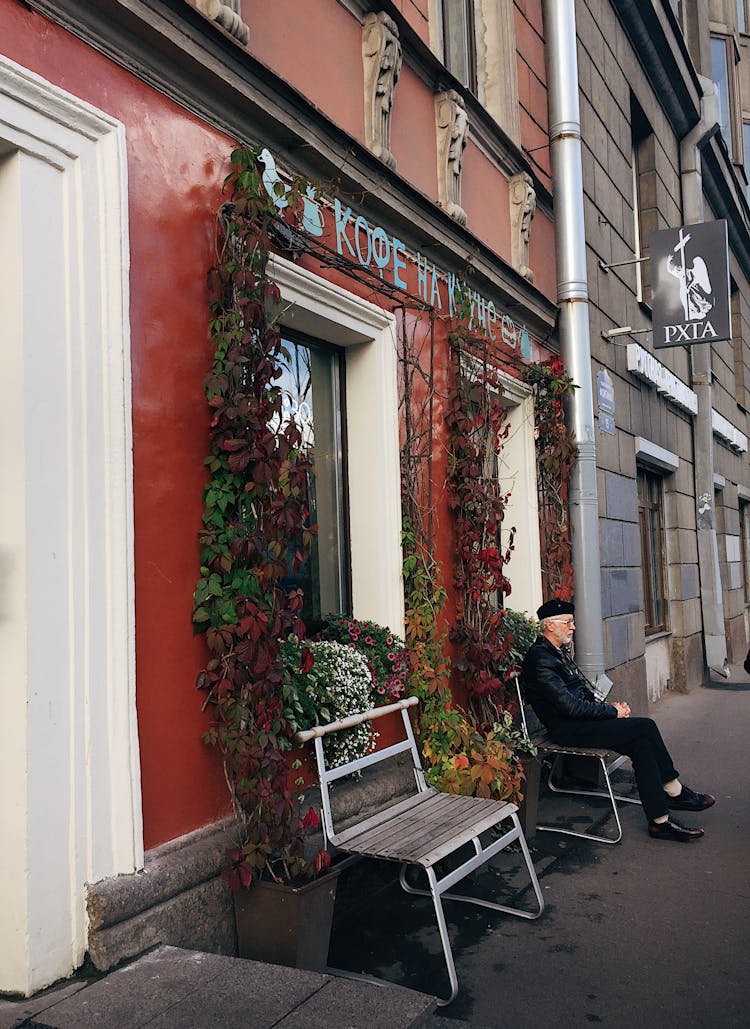 Man Sitting On Bench