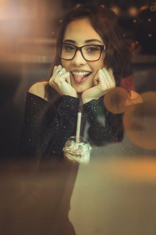 Woman In Black Off-shoulder Shirt And Black Framed Eyeglasses