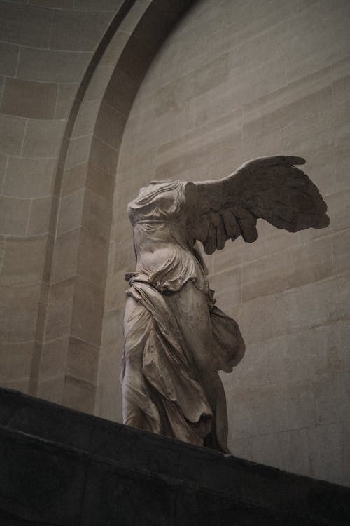 Free A statue of an angel is on display in the louvre Stock Photo