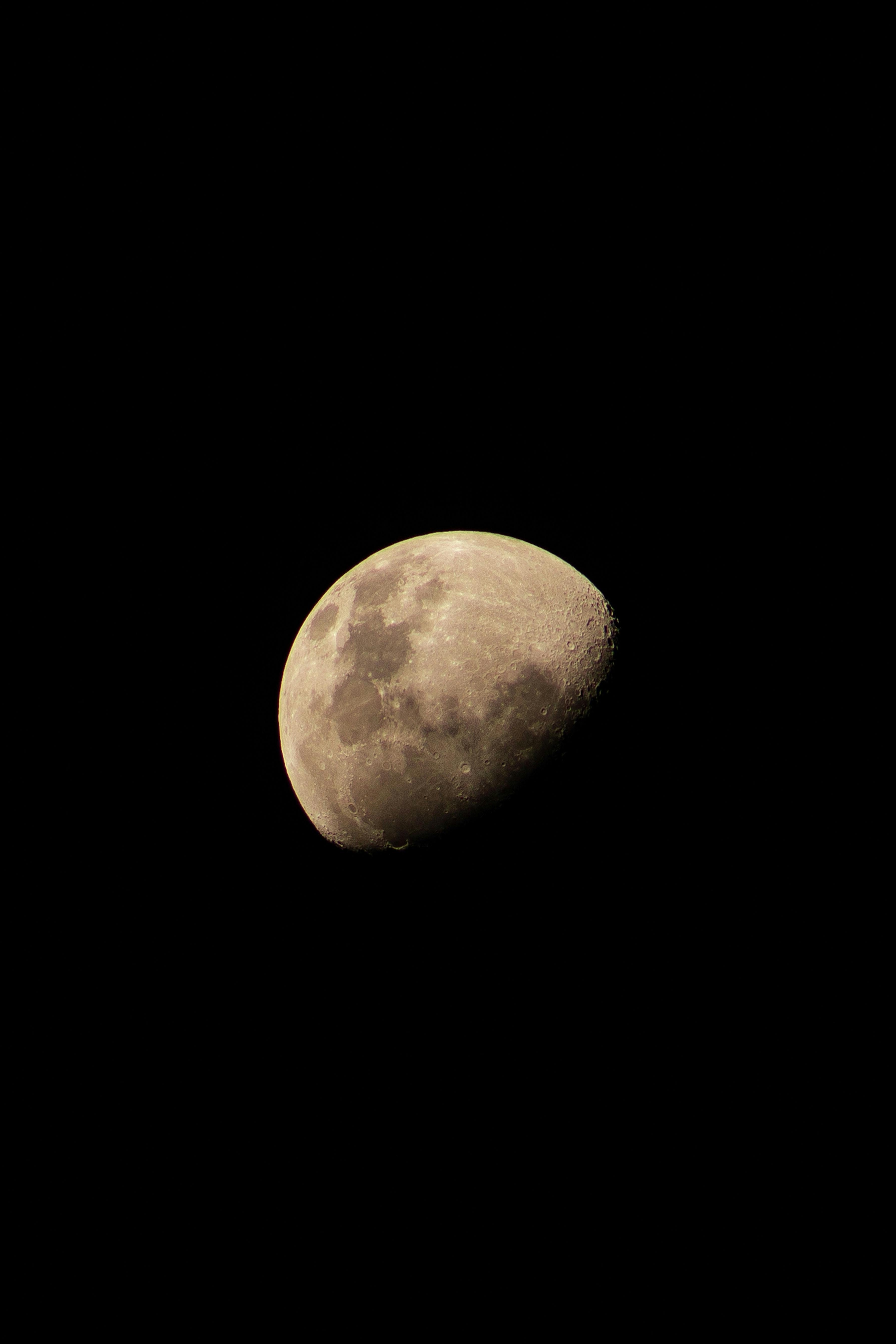 Beautiful crescent moon captured in a clear night sky, showcasing lunar details.