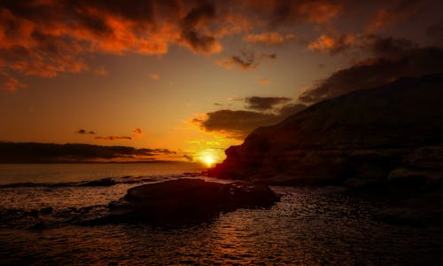 Photos gratuites de ciel spectaculaire, côte, coucher de soleil